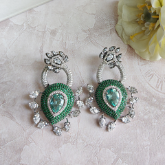Emerald enchanted danglers